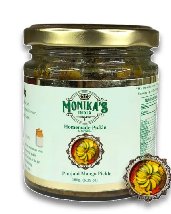 This is my signature Punjabi Mango Pickle, a flavour I grew up with. It's made with raw mangoes, cold-pressed mustard oil, and a robust blend of Punjabi spices. Each bite is a taste of home.