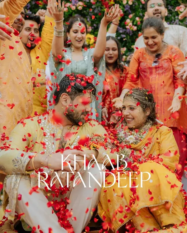 A perfect Haldi shot, with the couple surrounded by loved ones under a shower of rose petals. This is the kind of joyful, chaotic moment I love to capture.