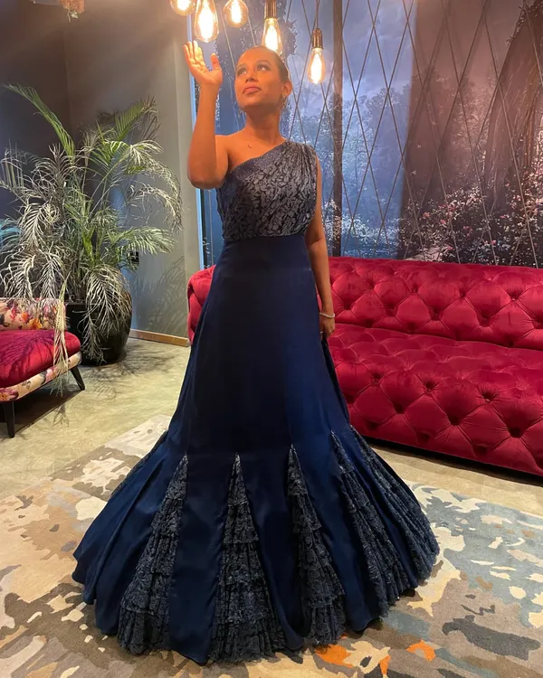 This versatile and chic blue gown effortlessly takes you from a wedding reception to a glamorous cocktail affair. The structured mermaid-style flare adds a touch of dramatic elegance.