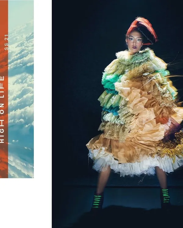 A look from the 'UNRUFFLED' series, featuring a multi-textured, ruffled dress that creates an explosion of color and form. The styling here is about creating a wearable sculpture that feels both chaotic and beautiful.