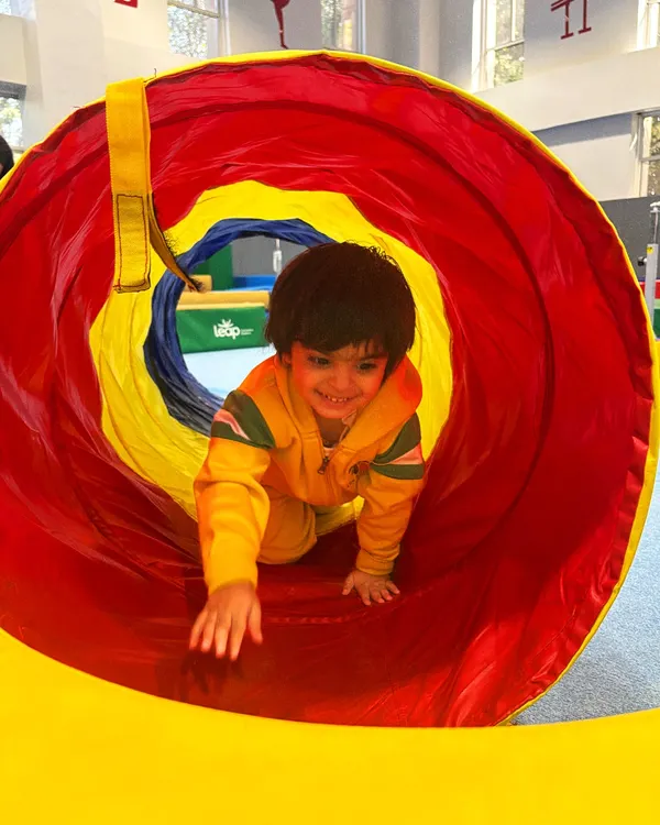 This is what pure joy looks like. We believe in creating a space where even our tiniest members can explore, play, and discover the fun in movement, building confidence from their very first crawl through the tunnel.