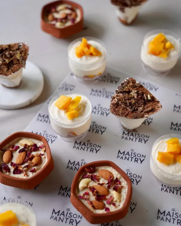A selection of my individual desserts, perfect for a flying buffet at a Diwali party. This image shows Mango Mousse, Tiramisu, and Phirni, offering something for every sweet tooth.