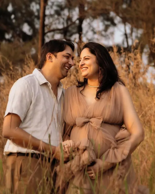 The best photos come from genuine smiles. I prompted this couple to share a quiet joke, and the result was this beautiful, unscripted moment of laughter during their golden hour maternity shoot.