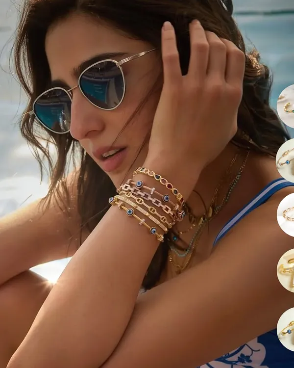 This is the main character energy I'm talking about. The stunning Sara Ali Khan is giving major summer goals, slaying by the pool in a custom Upakarna evil eye bangle stack. Yes, you can take them for a swim.