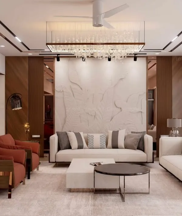 A wide view of a modern luxury living room, showcasing a balanced composition of sleek white sofas, terracotta accent chairs, and a stunning textured marble feature wall. The recessed ceiling with rose gold trim adds a layer of sophistication.
