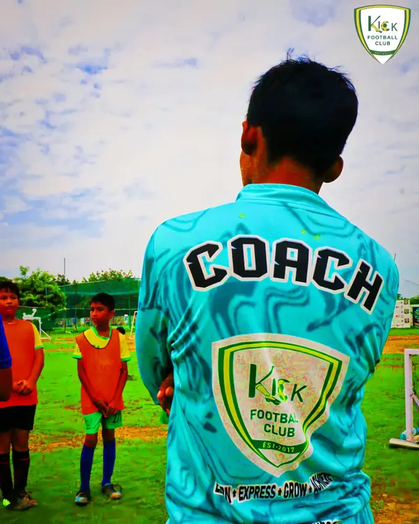 The back of a coach's jersey says it all. Our coaches lead by example, embodying the club's values of learning, expression, growth, and achievement.