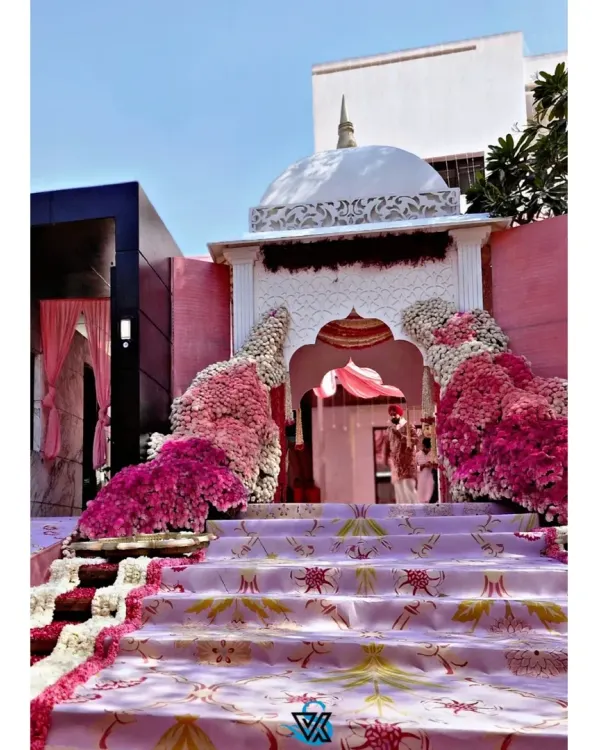 This grand entrance was designed for an Anand Karaj ceremony, creating a breathtaking first impression. I built this custom structure, complete with a traditional dome and cascading floral arrangements in shades of pink, to welcome guests into a sacred space filled with love and celebration.