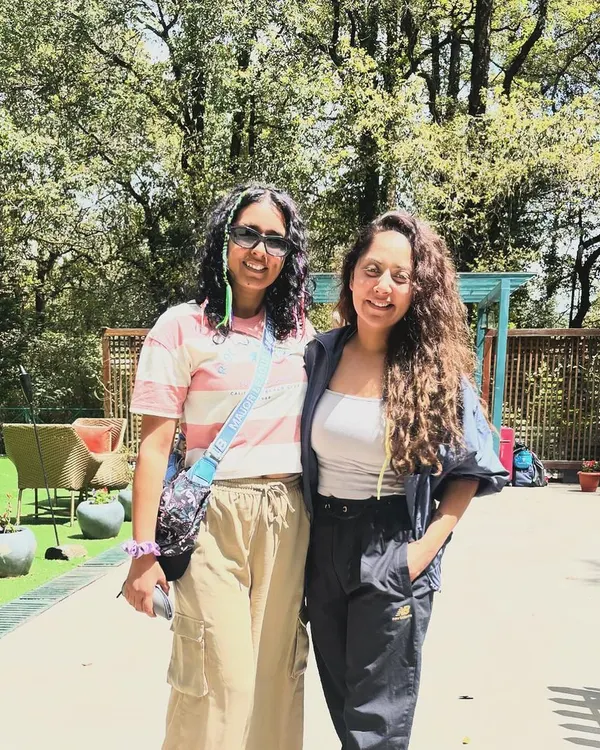 Two members of our tribe enjoying the serene atmosphere at our Nainital jungle resort. It's a chance to disconnect from daily life and reconnect with yourself and like-minded people.