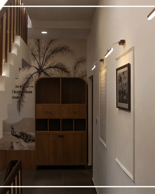 A view of the reimagined transition space at the Bangalore Club. We used a striking wall mural, warm wood storage, and focused lighting to transform this hallway into a memorable part of the health club experience.