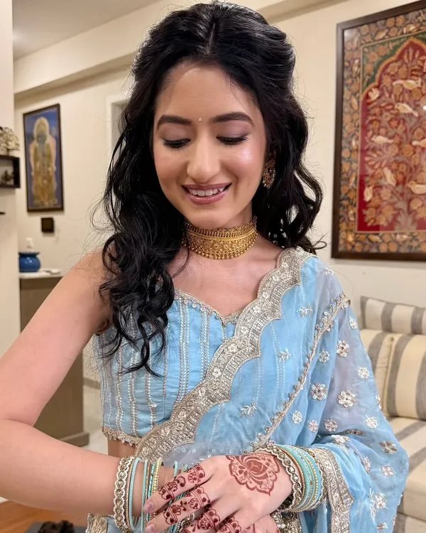 A dreamy glow for her Roka ceremony. I used subtle eye makeup and a natural flush on the cheeks to create a look of timeless elegance that perfectly complements her pastel blue saree.
