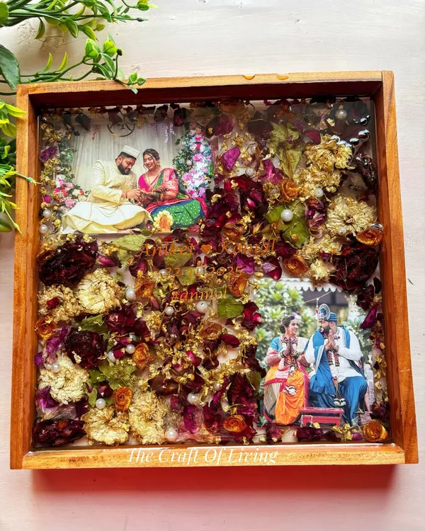 This 12x12 inch teak wood frame is one of my most requested pieces. It allows for a beautiful arrangement of your varmala flowers around two of your favorite wedding photos. The depth of the frame creates a stunning 3D effect, making it a true heirloom piece that captures the grandeur of your wedding day.