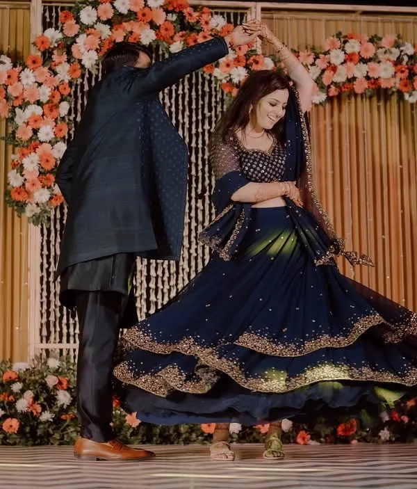 A perfect twirl during the couple's sangeet performance. We focus on creating these picture-perfect moments that you'll cherish forever.