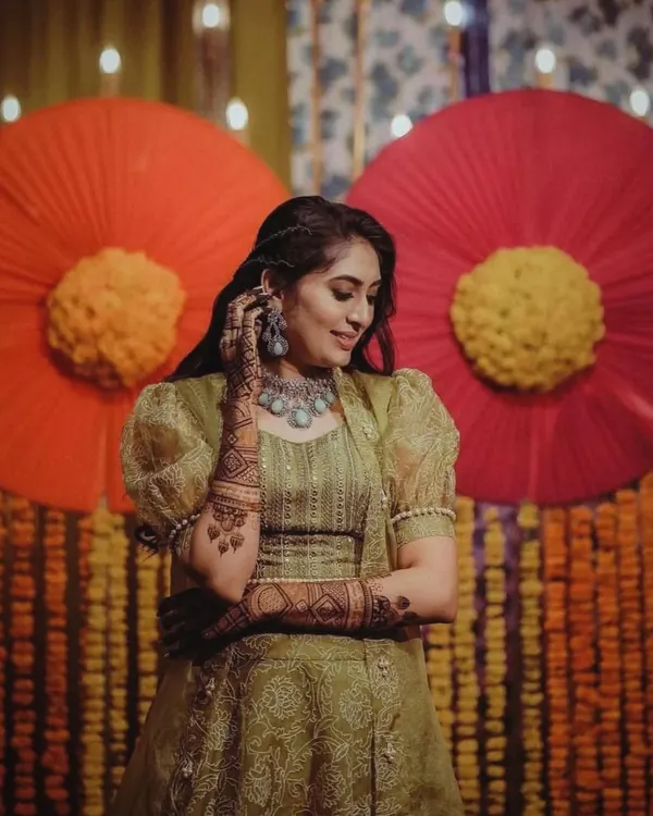 A beautiful client looking stunning at her mehndi function. I created a full bridal-style design for her that complemented her gorgeous outfit and jewelry perfectly.