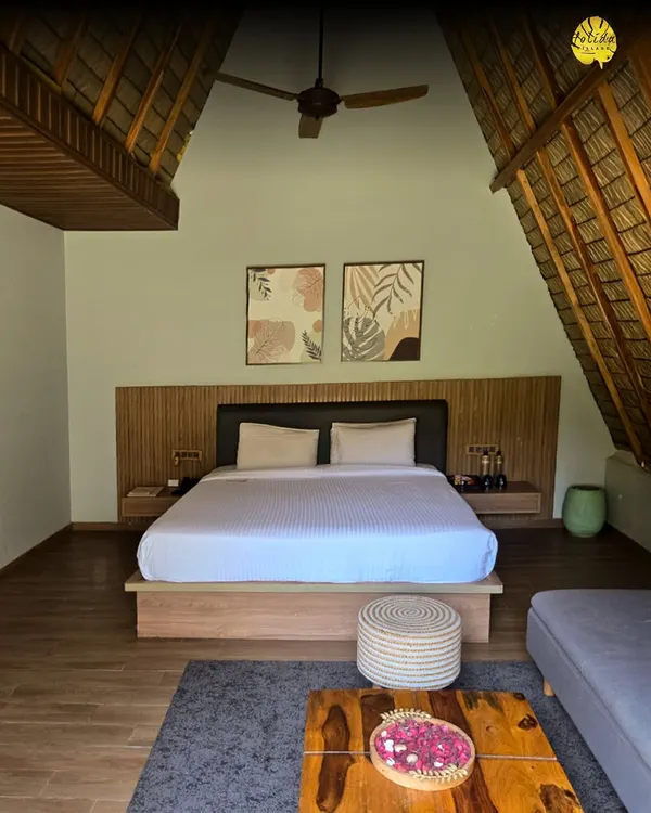 Step inside our A-frame chalet. With its high thatched roof, modern furnishings, and cozy ambiance, it offers a unique and comfortable stay for you or your guests.
