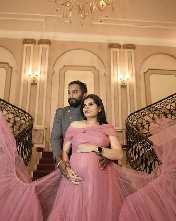 A fairytale moment. This flowing pink tulle gown is perfect for capturing the magic of your maternity journey. Available for rent.
