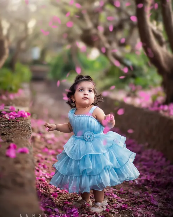 This is the magic we live for. In a shower of bougainvillea petals, we captured this little princess living in her own fairytale moment. These are the portraits that freeze time, turning a fleeting afternoon into a treasured memory.