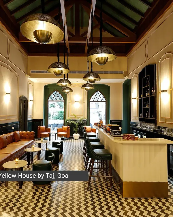 The bar at the Yellow House by Taj, Goa, is a study in heritage revival. I restored the Portuguese-inspired villa, blending a historic trussed roof and arched windows with a modern chevron-patterned floor and custom brass lighting to create a timeless atmosphere.