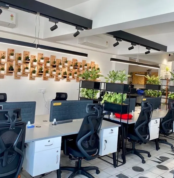 This is how I bring a modern office to life. For this project in Powai, I integrated greenery directly into the workspace with custom planters on desk partitions and a unique wall-mounted plant display, creating a vibrant and productive atmosphere for the entire team.
