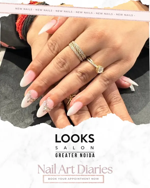 A perfect example of bridal nail artistry. These elegant almond-shaped extensions are finished with a classic French manicure base and accented with delicate 3D crystal embellishments for that extra sparkle on the big day.