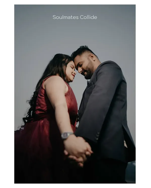 A classic, intimate pre-wedding pose. Holding hands and touching foreheads creates a powerful feeling of connection.