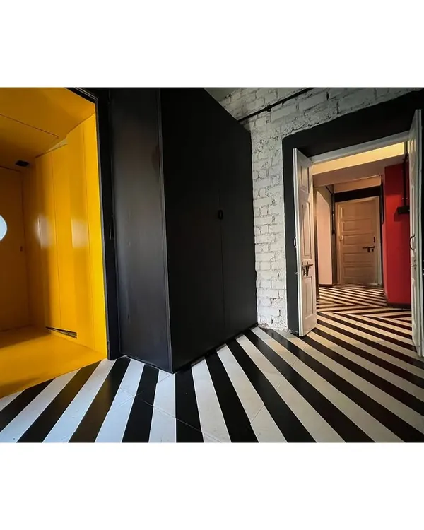 The interior of our CoLive @ TAS project, where we resurrected a dilapidated 1960s apartment. The design uses bold graphic flooring and color blocking to create a dynamic living space for the architects of our studio.