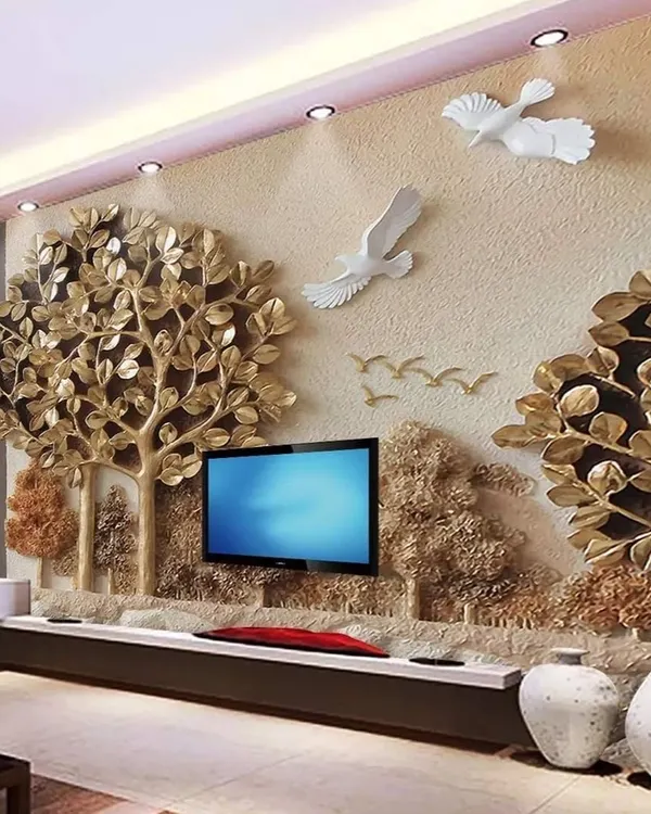 This 3D wallpaper featuring a golden tree of life is a perfect example of a high-impact feature wall. The raised, metallic elements catch the light beautifully, creating a luxurious and artistic focal point for a living room or entryway.