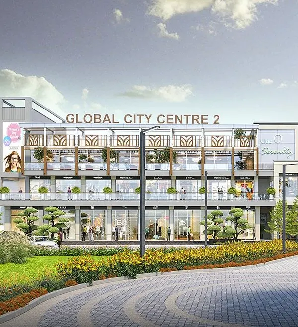 The full frontal elevation of Global City Centre 2. The design features a modern facade with a strong horizontal emphasis, extensive use of glass for retail visibility, and integrated greenery on the upper-level terraces.