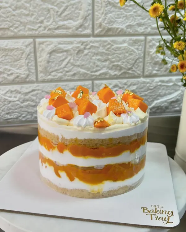 Mango madness is here! My Mango Tango cake features layers of moist vanilla sponge, fresh Alphonso mango pulp, Chantilly cream, and fresh mango pieces. It's a taste of sunshine!