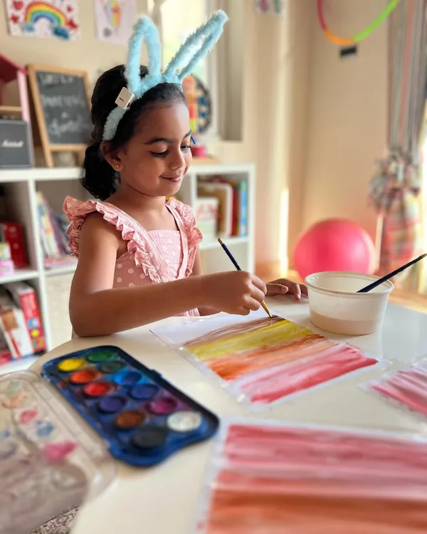 This little bunny is painting a beautiful sunset with watercolors. We teach simple techniques that allow kids to create stunning effects with ease.