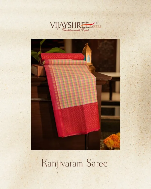 A Kanjivaram that plays with color. This saree features vibrant multicolor checks, grounded by a traditional red korvai gap border and pallu.