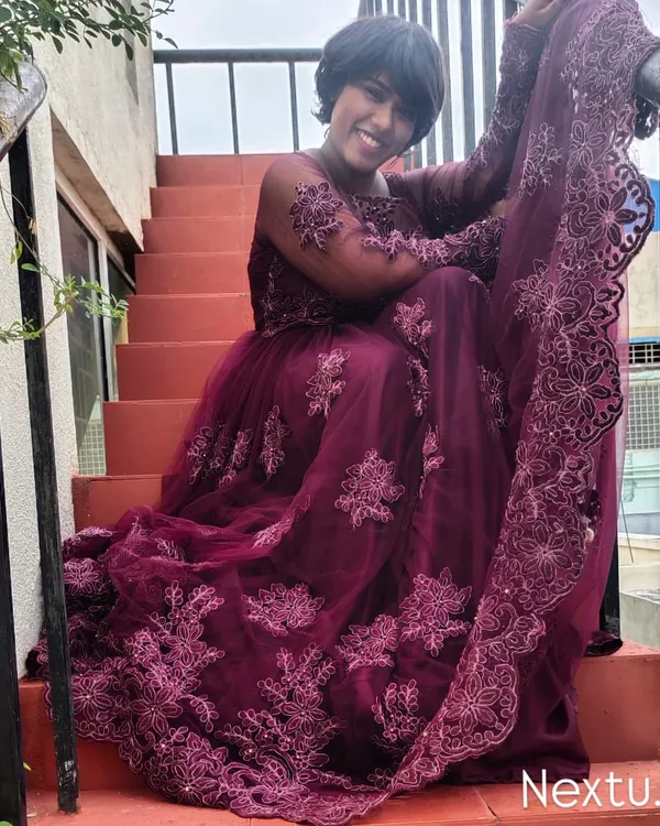 A shot from a photoshoot in this beautiful embroidered purple gown. I love the drama and elegance of this outfit, sitting on the stairs.