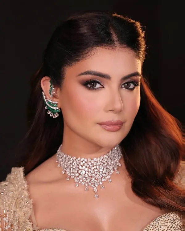 This is the epitome of couture glamour. I created this look with a focus on bronzed, luminous skin and a dramatic, yet soft, smokey eye to complement the exquisite diamond and emerald jewelry. It’s a bold statement of elegance, perfect for a grand cocktail event or reception.
