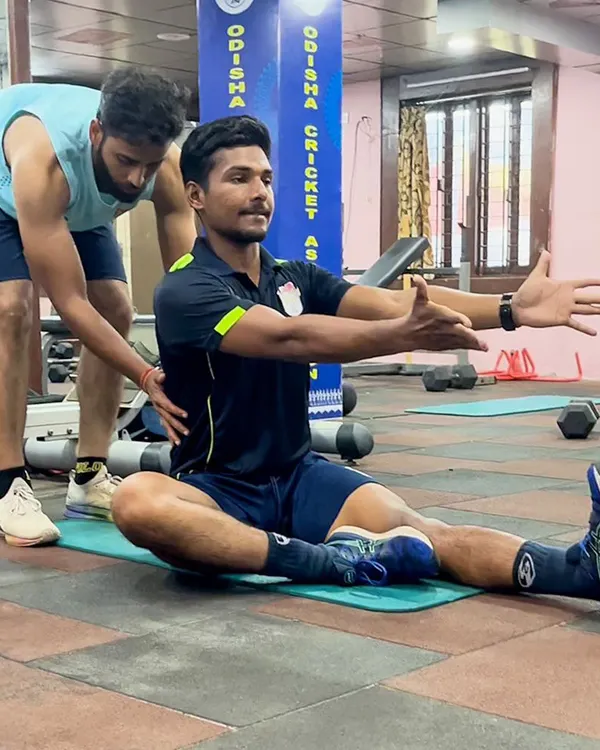 Here, I am assisting an athlete with a myofascial stretch. This technique helps to release tension in the connective tissue, improving mobility and reducing the risk of muscle strains.