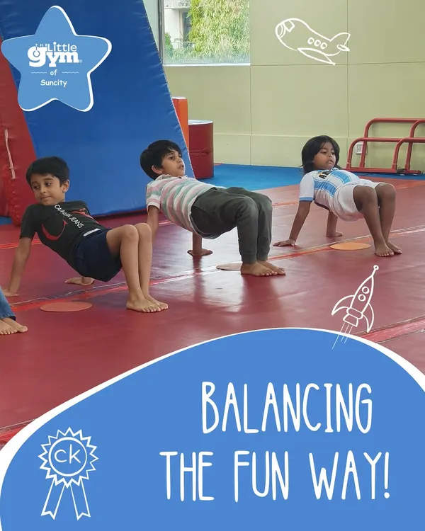 Learning to balance is a fun challenge. These boys are practicing a core-strengthening exercise that improves stability and body control, all while looking like little crabs.