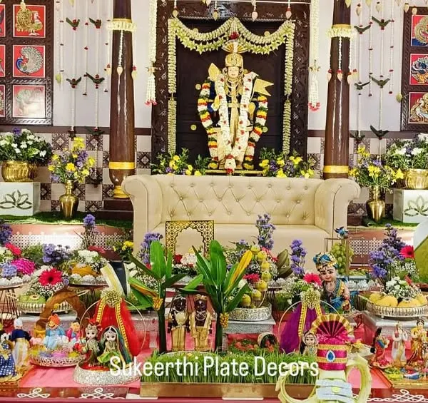This is a beautiful example of a grand 'seer varisai' setup for an ear-piercing ceremony. I arranged dozens of platters with fruits, sweets, and my signature handmade dolls on an artificial grass carpet to create a vibrant and traditional display.
