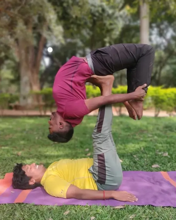 This is what faith looks like in AcroYoga. As the base, I'm supporting my partner in a deep backbend, a variation of Urdhva Dhanurasana. It requires stability from me and trust from him.