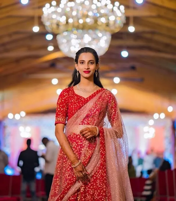 This client looks absolutely radiant for her brother's engagement. I created a timeless look with a bold red lip and clean, defined eyes, paired with simple, elegant hair to let her beautiful red outfit shine.