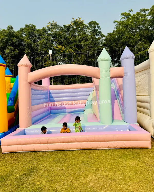 Our beautiful Pastel Paradise Castle, featuring a slide and a ball pit in soft shades of pink, purple, and mint. It's the perfect dreamy addition to any little one's party.