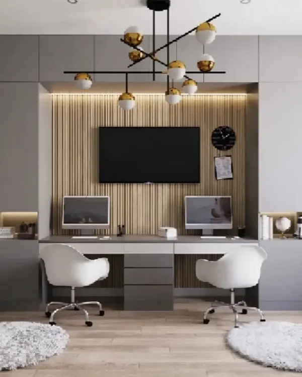 A perfect work-from-home solution for two. This design features a long desk with dual workstations, flanked by floor-to-ceiling cabinets for ample storage, creating a complete and organized home office.