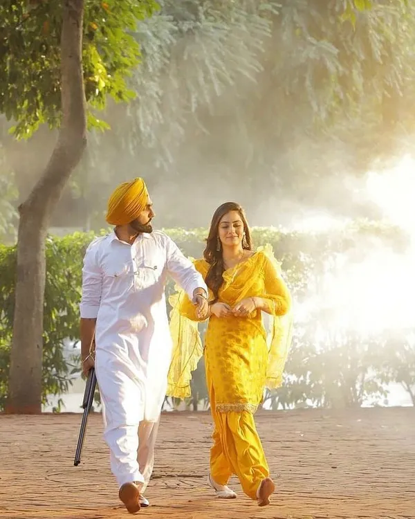 A beautiful still from 'Khabi Seat' featuring Ammy Virk and Sweetaj Brar. I chose this classic yellow salwar suit to create a timeless and romantic Punjabi look that perfectly complemented the song's earthy and heartfelt vibe.