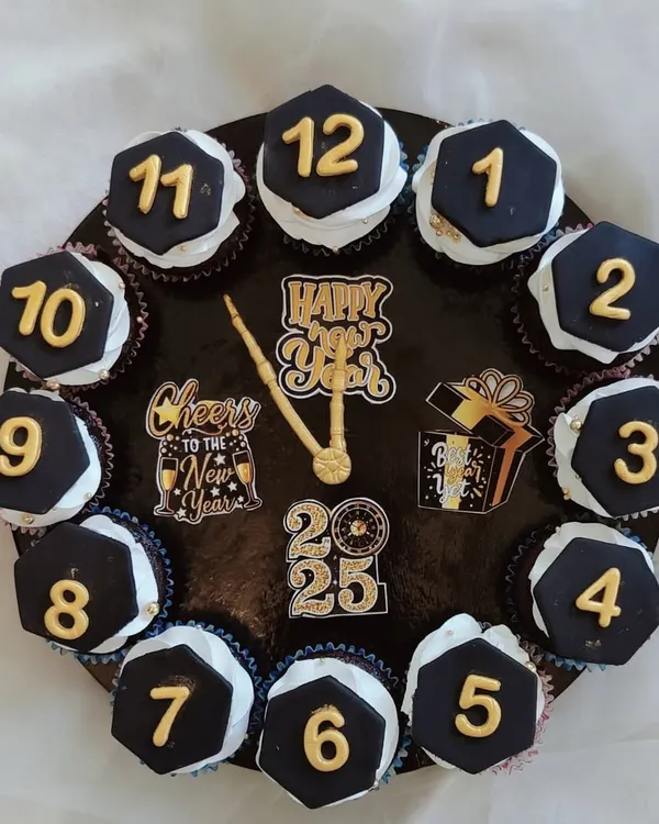 I designed this unique New Year's countdown clock as a custom cupcake arrangement. Each of the twelve cupcakes features a handmade fondant number, creating a delicious and interactive centerpiece for a New Year's Eve party.
