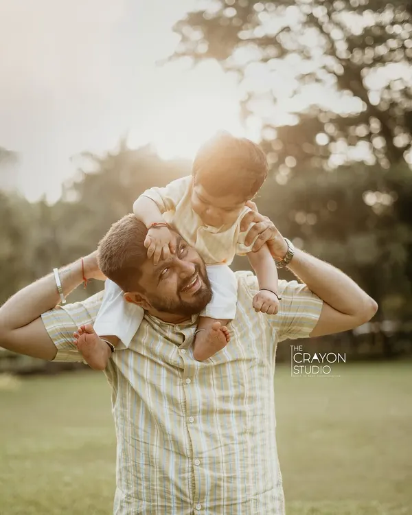 There is a special kind of magic in the bond between a father and his child. I love capturing these simple, joyful moments, like a piggyback ride in the golden afternoon light, that you will cherish forever as a timeless family memory.