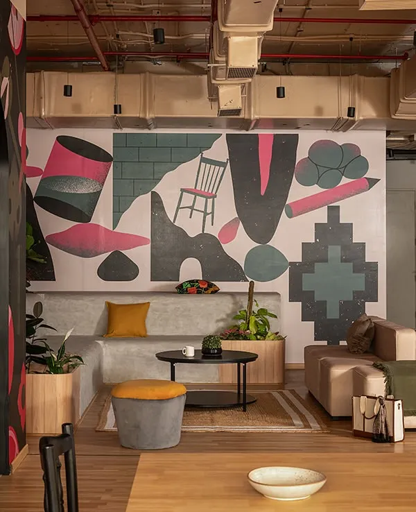 This amphitheater space designed for UPSTOX is the heart of their collaborative zone. The custom wall graphic brings incredible energy, creating a perfect backdrop for town halls, brainstorming sessions, and informal team gatherings in a modern corporate environment.