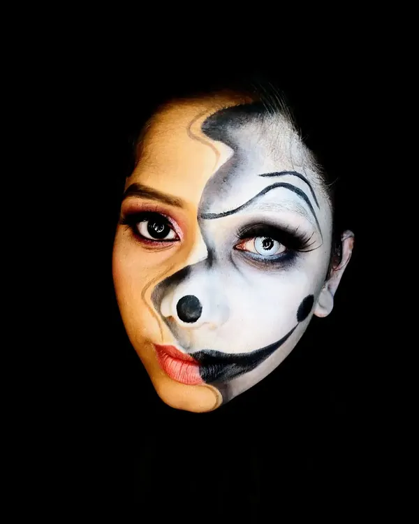 This two-faced illusion makeup is a personal favorite, demonstrating the power of makeup to transform and tell a story. The sharp contrast between the glam and the grotesque is perfect for avant-garde projects.