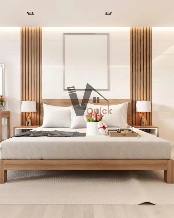 A look at minimalist bedroom design. This space uses a neutral color palette, natural wood tones, and clean lines to create a serene and calming retreat. Vertical wood slats and integrated headboard lighting add texture and warmth.