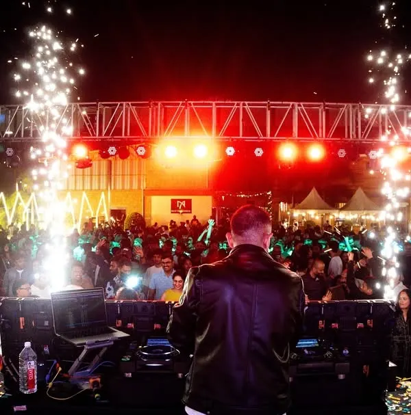 This is the view from my office. I don't just play for the crowd, I command it. This New Year's Eve bash shows the concert-level production I bring, complete with pyrotechnics and a stage that owns the night.