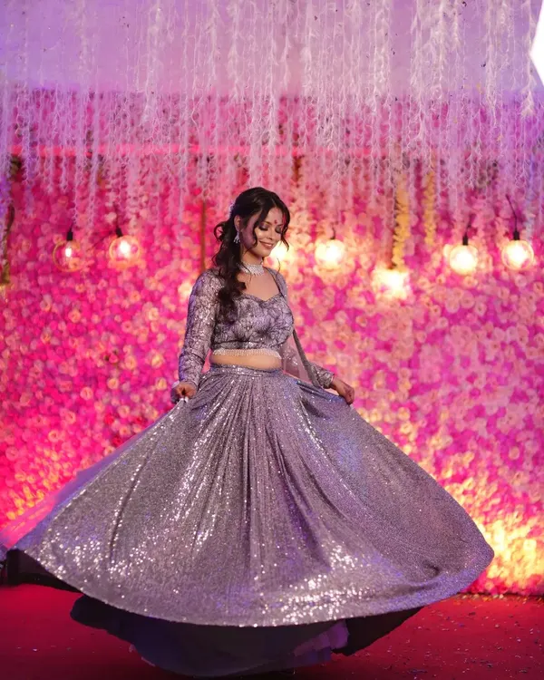 A beautiful bride twirling in her stunning sequined lehenga. A solo performance is the perfect opportunity for the bride to shine.