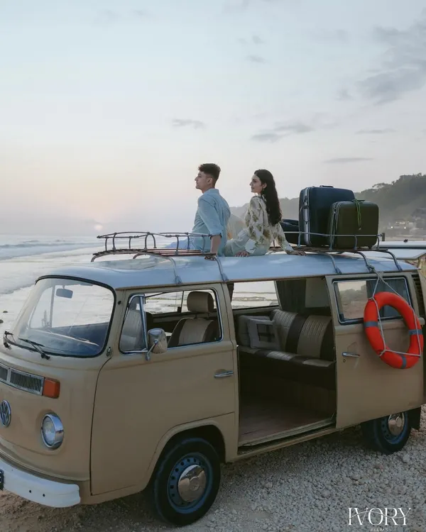 A beautiful sunset, a vintage van, and the open road ahead. We designed this adventurous pre-wedding shoot in Bali to capture the couple's free-spirited journey into their new life together, with the ocean as their witness.