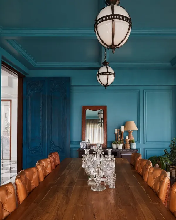 This teal conference room at Maddock Films is one of my favorite creations because it challenges the idea of a typical boardroom. I envisioned a bold, versatile space for both daytime meetings and intimate evening dinners, using a rich, monochromatic color scheme and a grand solid wood table to create an atmosphere that is both luxurious and deeply inviting.