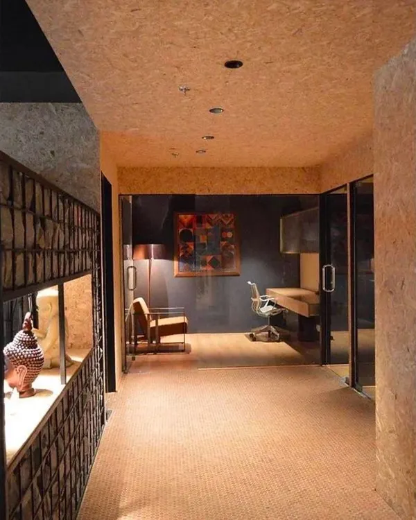 This is the Genesis Office, where I transformed a rented space into a contemporary workplace. I used a material palette of cork, oak, and raw pressed board to imbue the interior with an almost meditative quality.